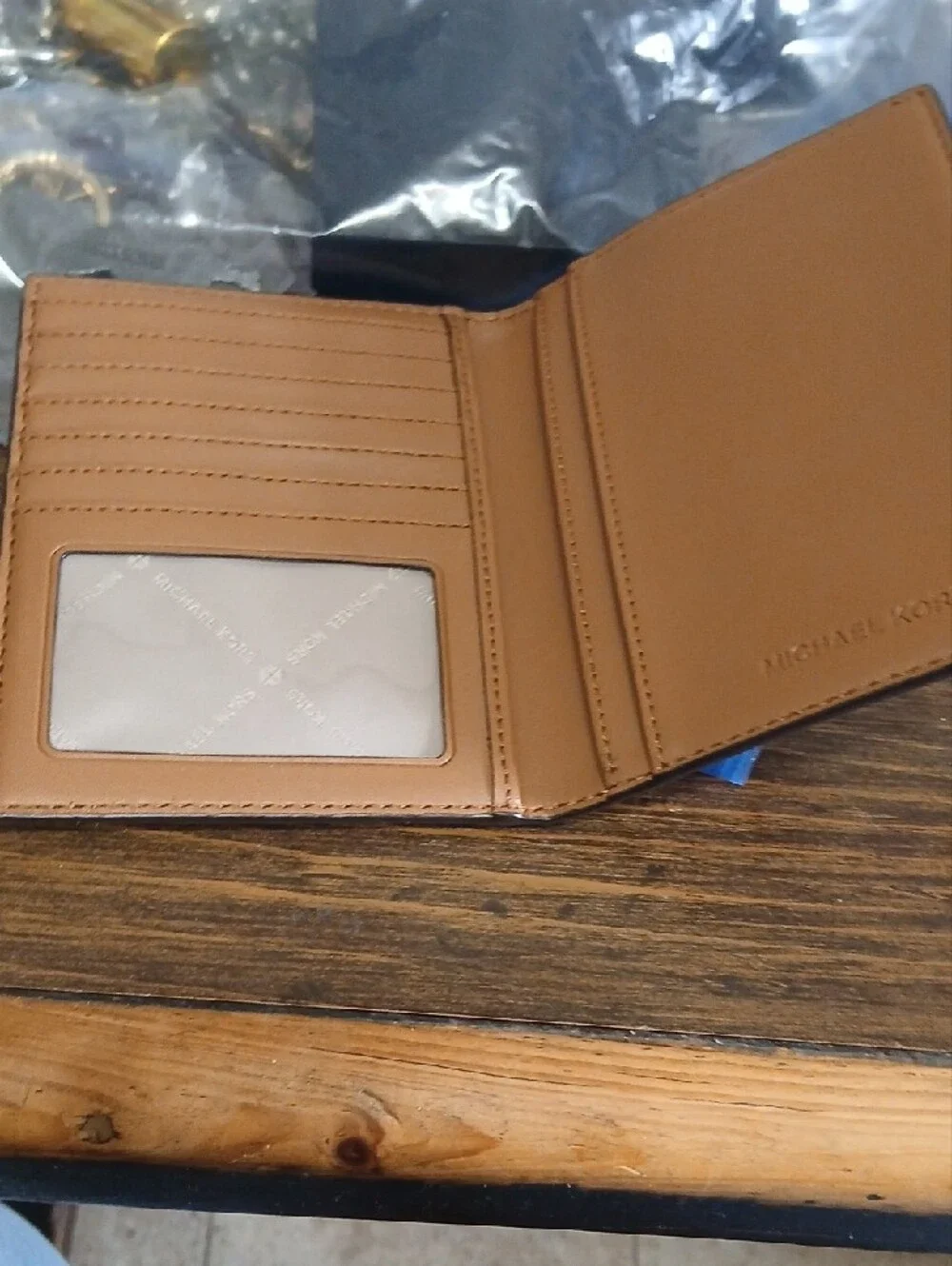 Michael Kors Brown Monogram Passport Holder with Gold Logo